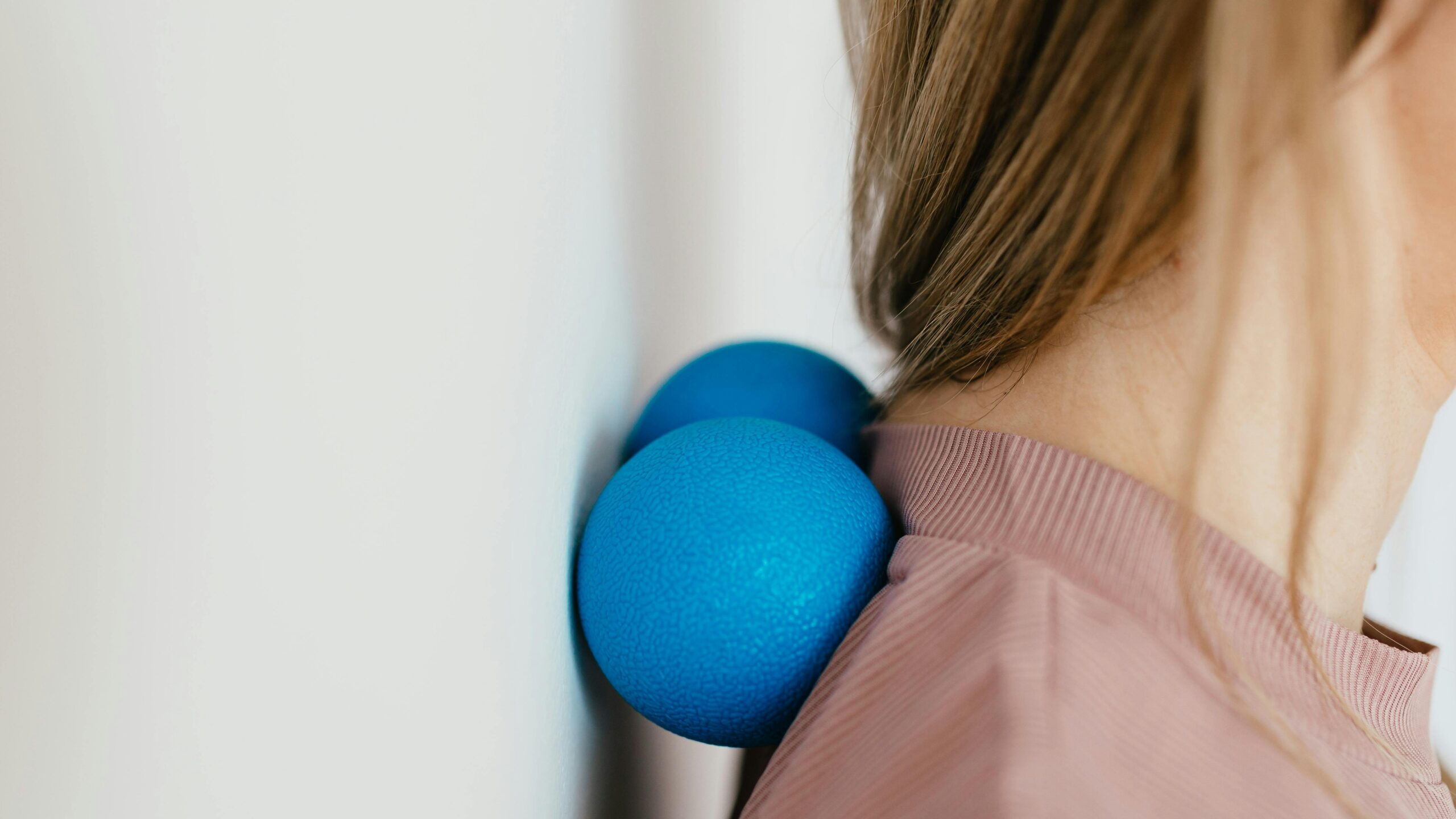Woman performing sphinx hold tech neck exercise on floor for stiffness relief