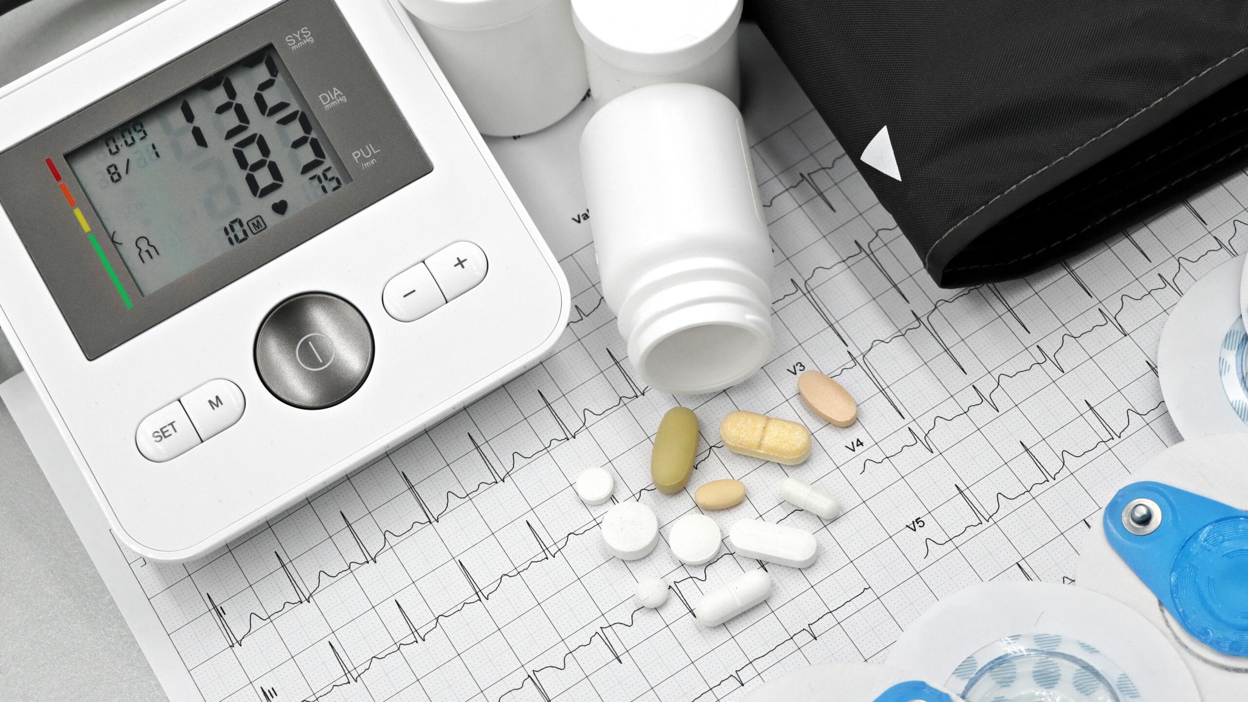 Cardiovascular tech performing an EKG on a patient
